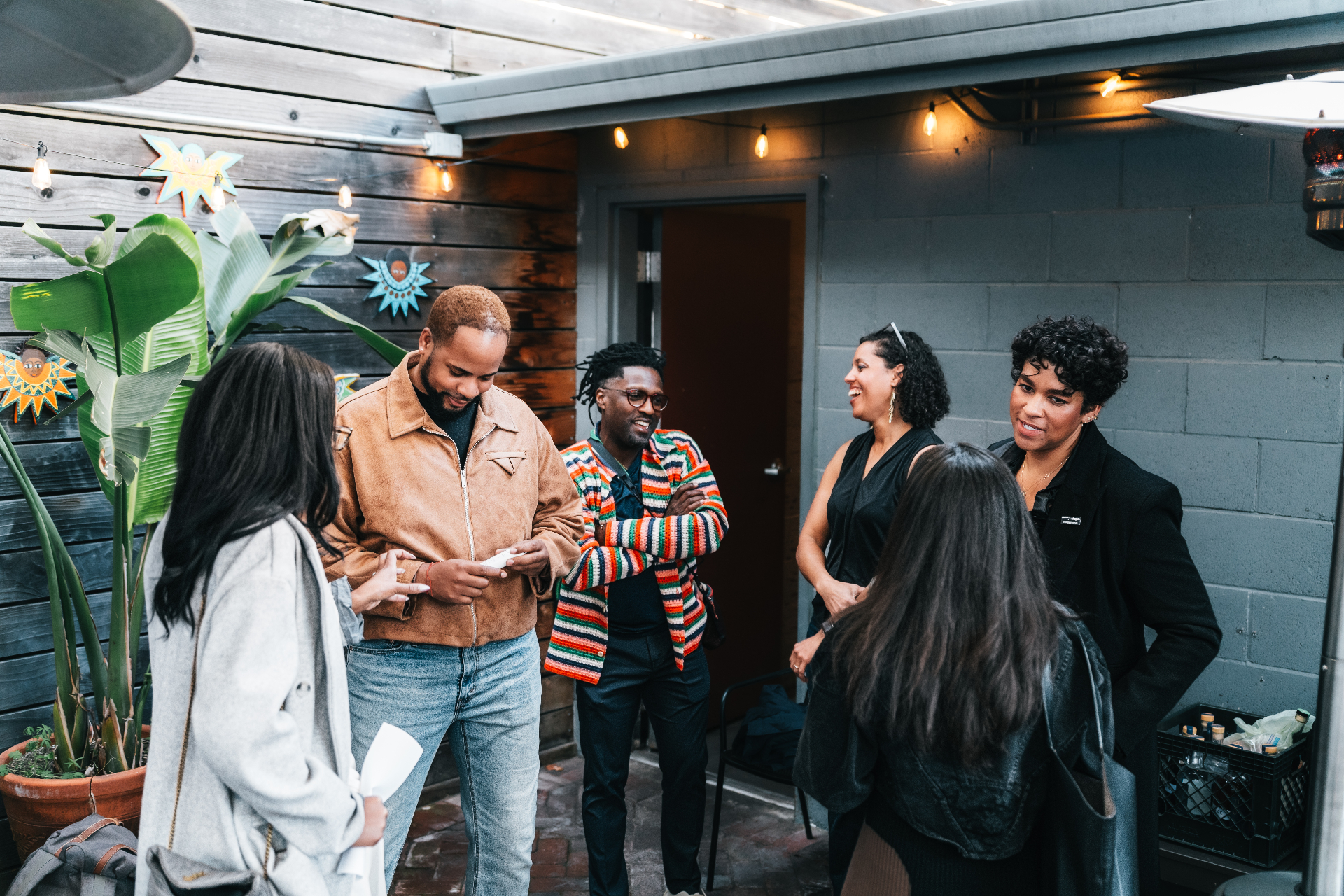Members gathered in conversation at an outdoor gathering