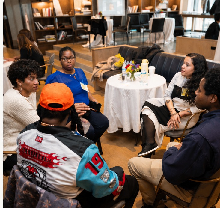 Members gathered in conversation at a Sanctum event